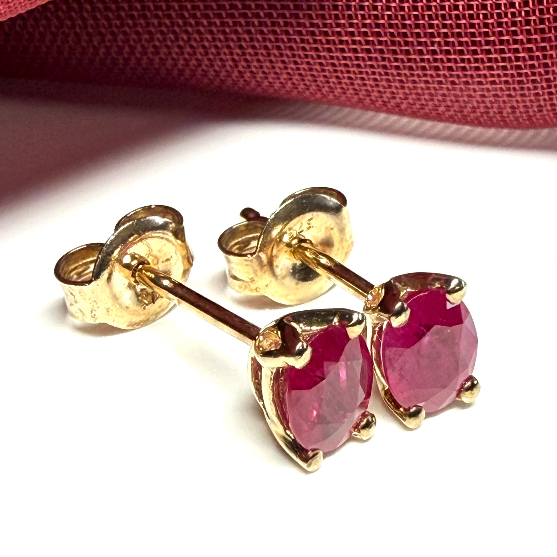 ruby oval yellow gold earrings
