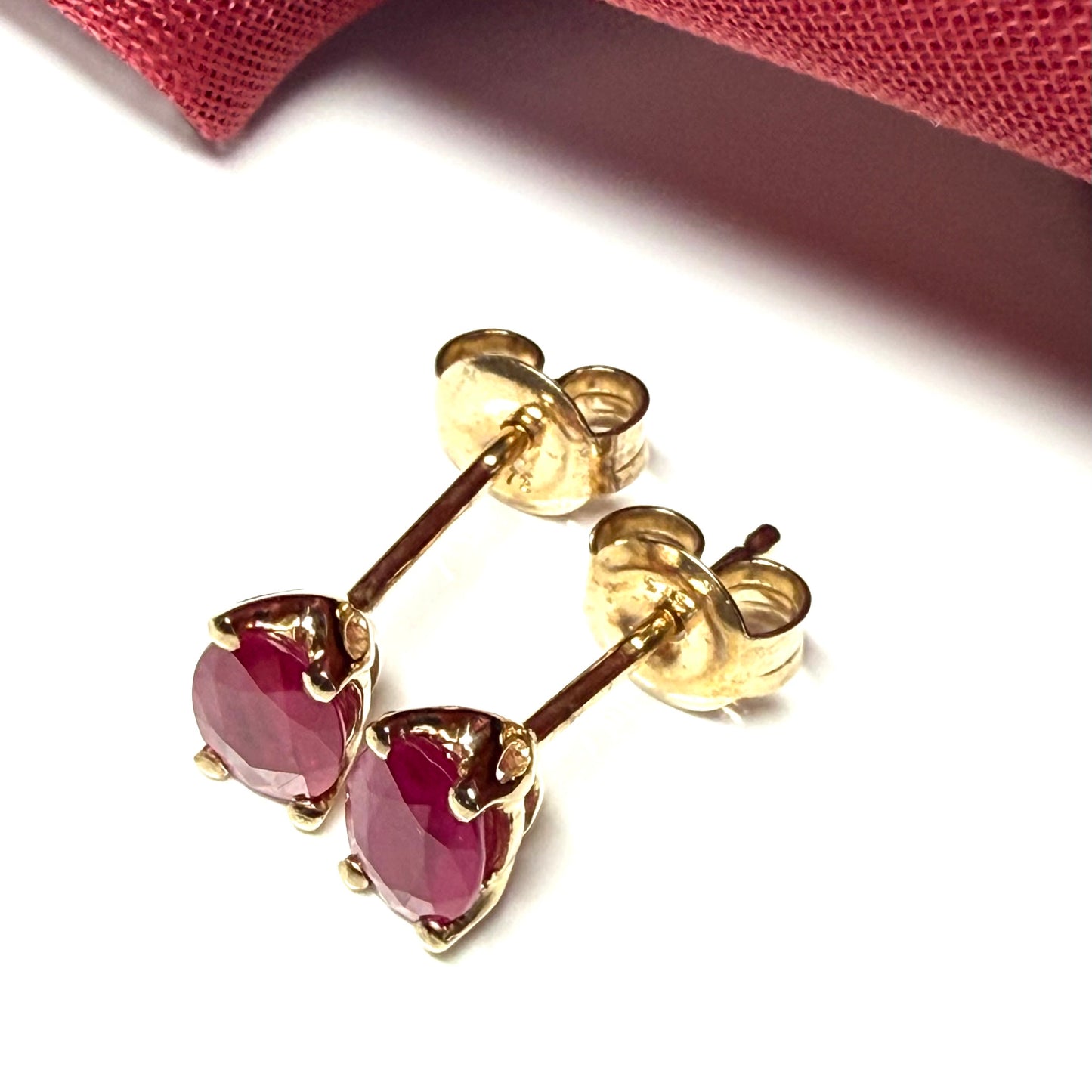 ruby oval yellow gold earrings