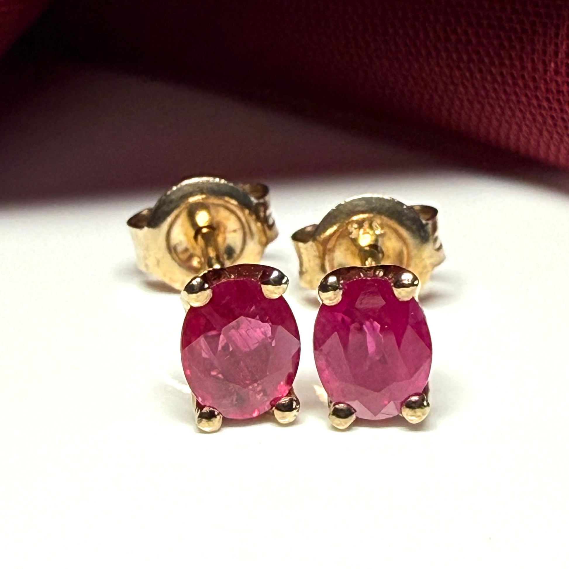 ruby oval yellow gold earrings