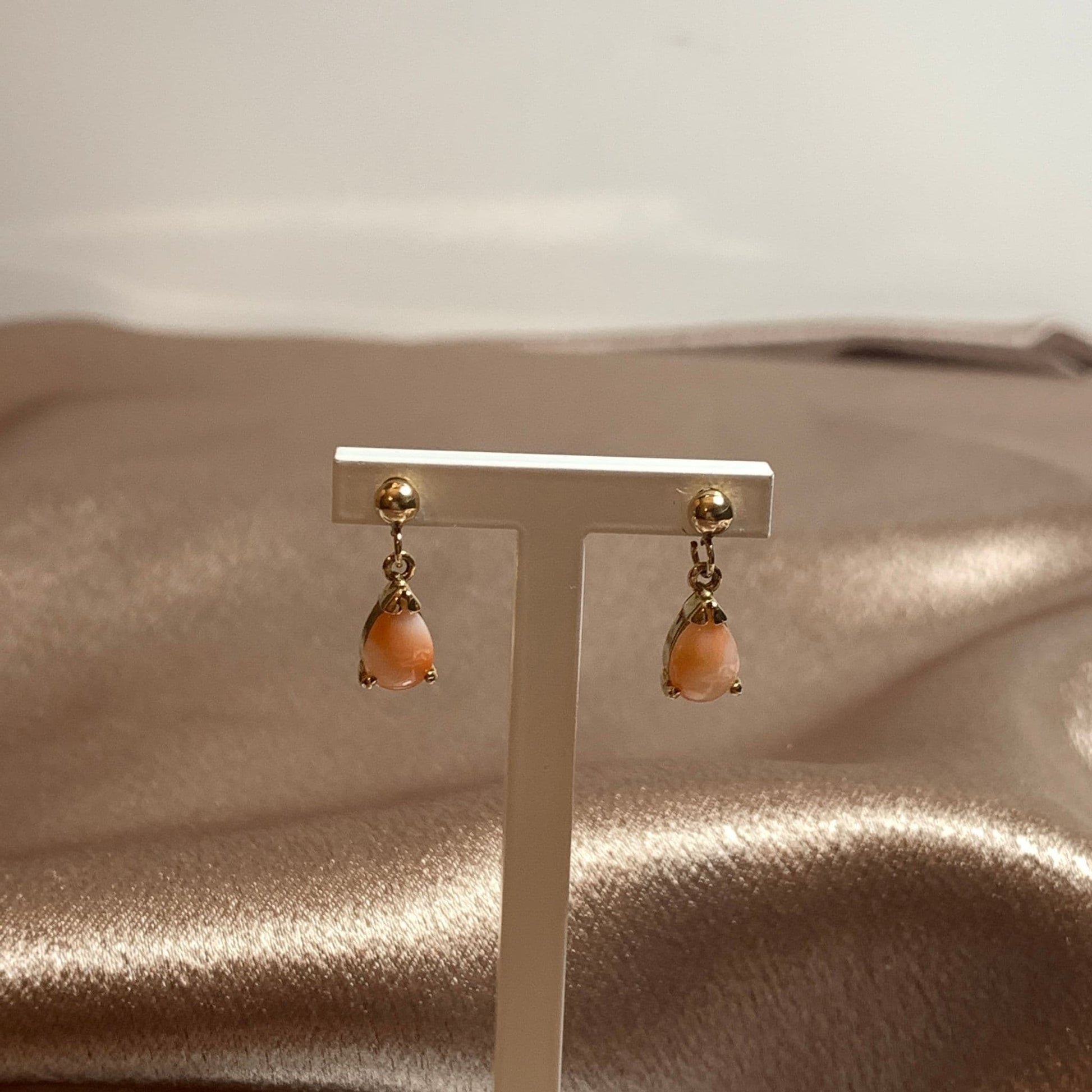 Teardrop pear shaped coral yellow gold drop earrings