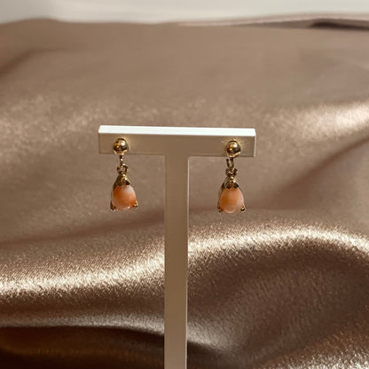 Teardrop pear shaped coral yellow gold drop earrings