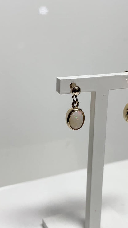 Opal drop oval yellow gold earrings