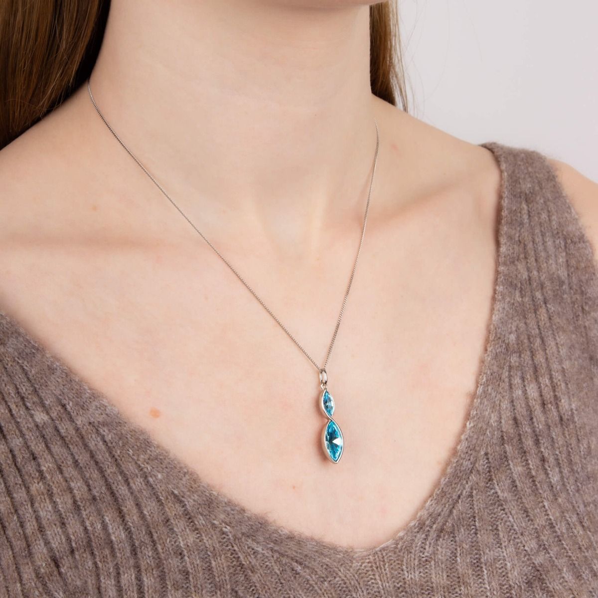 Fiorelli blue marquise shaped crystal necklace on neck