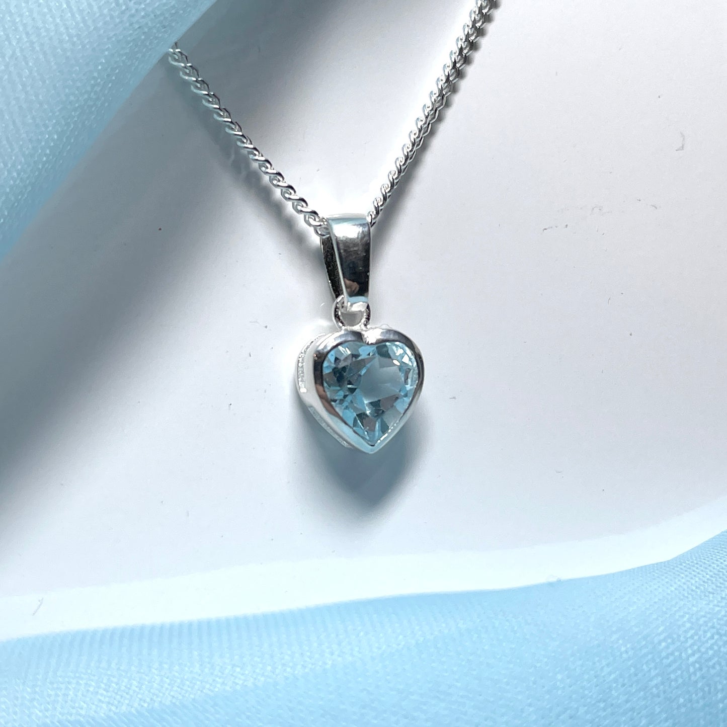 Heart shaped blue topaz sterling silver necklace pendant