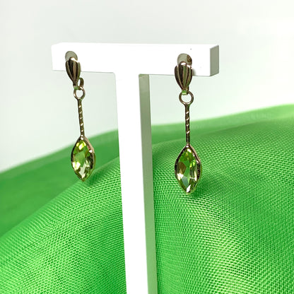 Marquise shaped peridot yellow gold drop earrings