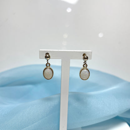 Opal drop oval yellow gold earrings