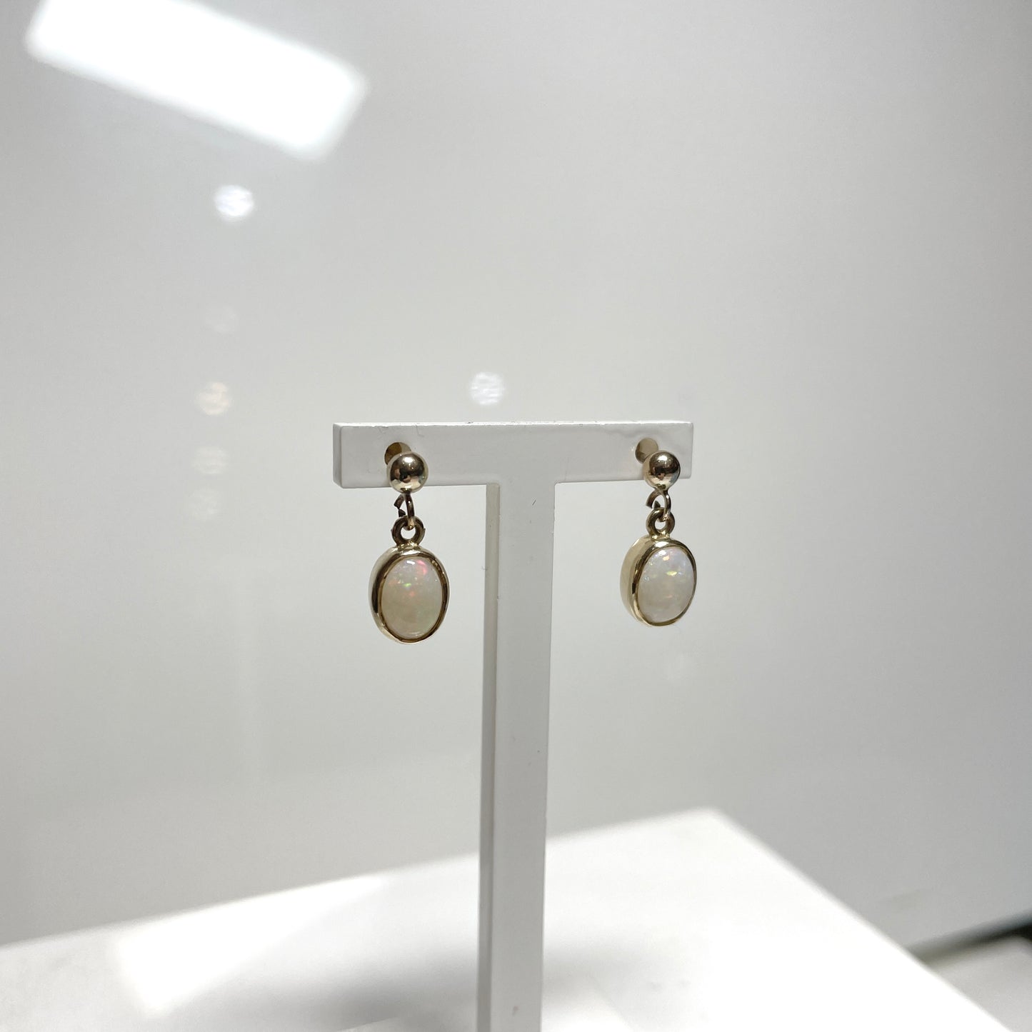Opal drop oval yellow gold earrings