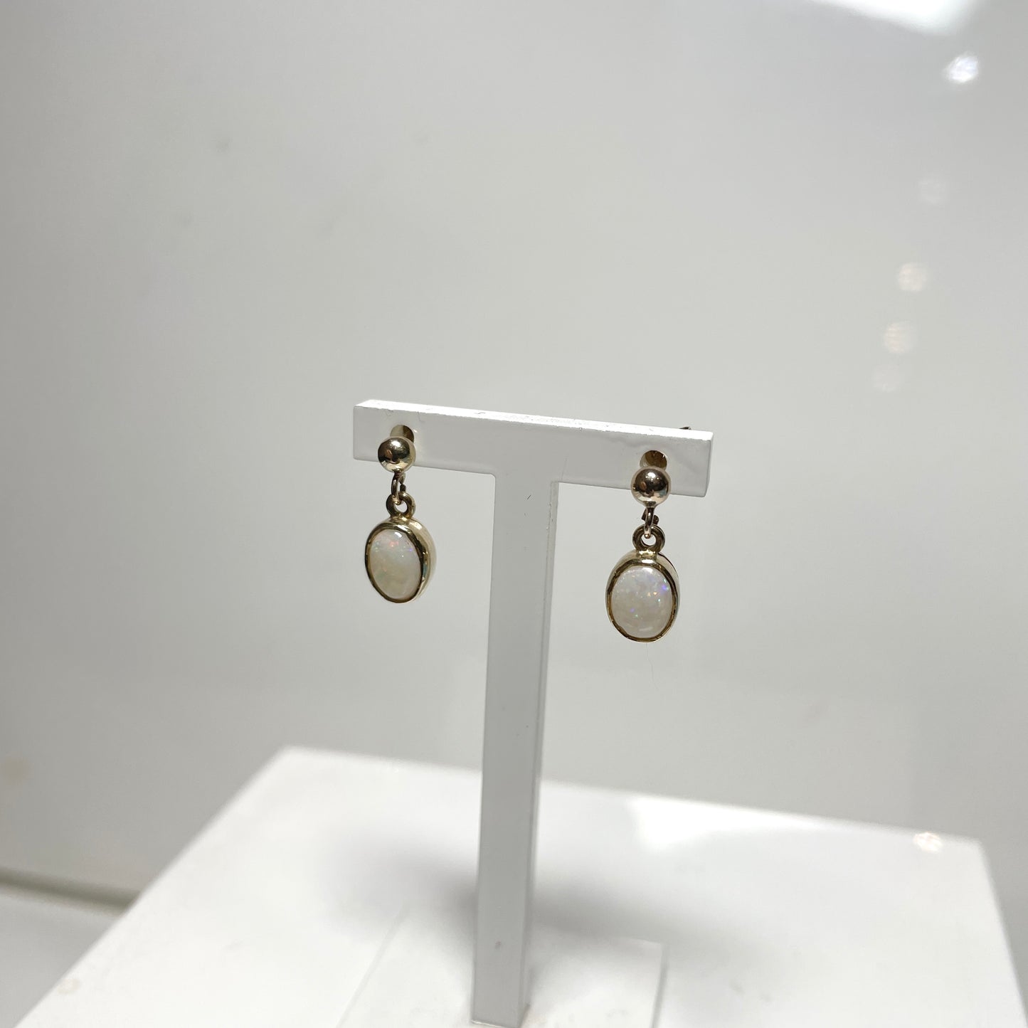 Opal drop oval yellow gold earrings