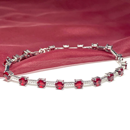 Oval sterling silver red cubic zirconia bracelet