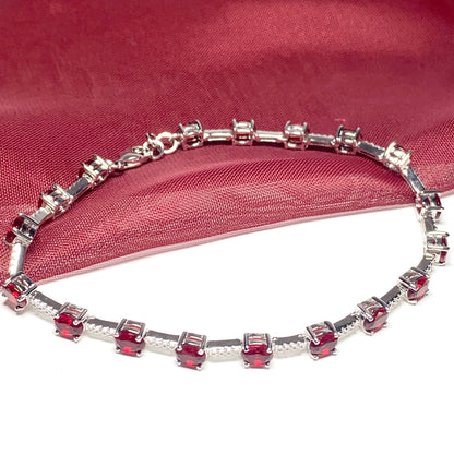 Oval sterling silver red cubic zirconia bracelet