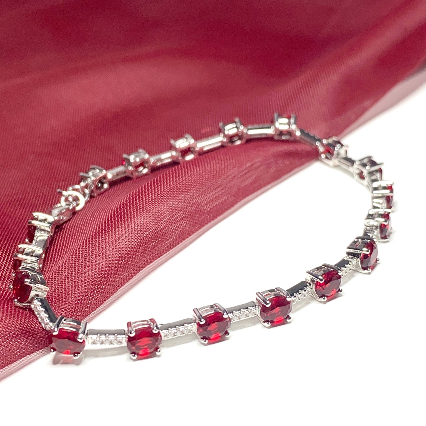 Oval sterling silver red cubic zirconia bracelet