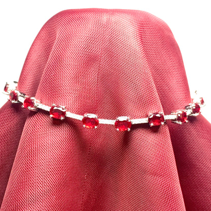 Oval sterling silver red cubic zirconia bracelet