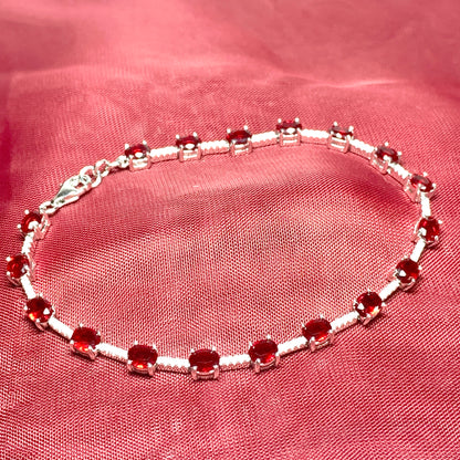 Oval sterling silver red cubic zirconia bracelet