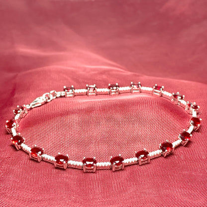 Oval sterling silver red cubic zirconia bracelet