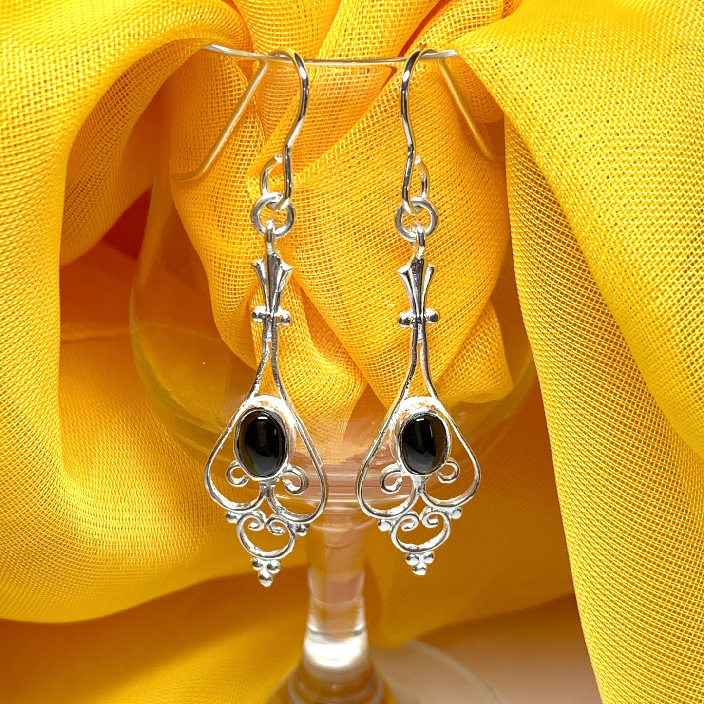 Patterned sterling silver black oval onyx drop earrings