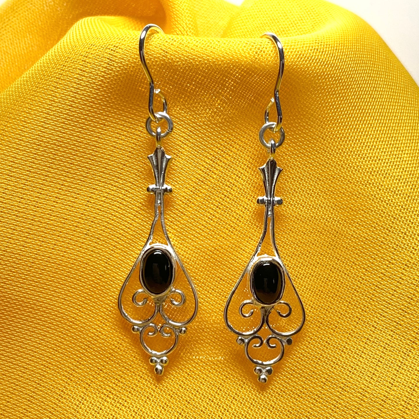 Patterned sterling silver black oval onyx drop earrings