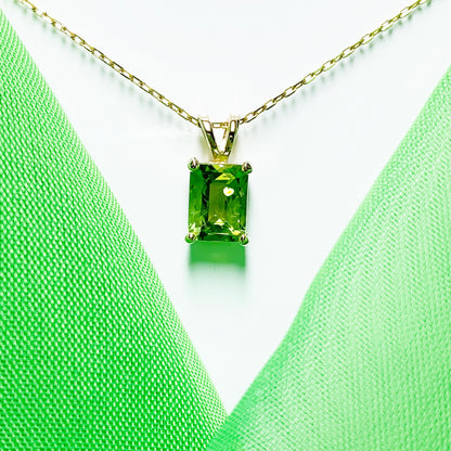 Peridot yellow gold claw set rectangle necklace