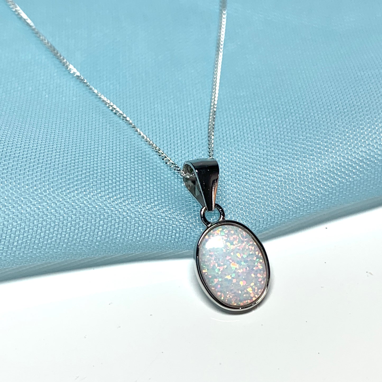 Sterling silver oval opal rubbed over necklace