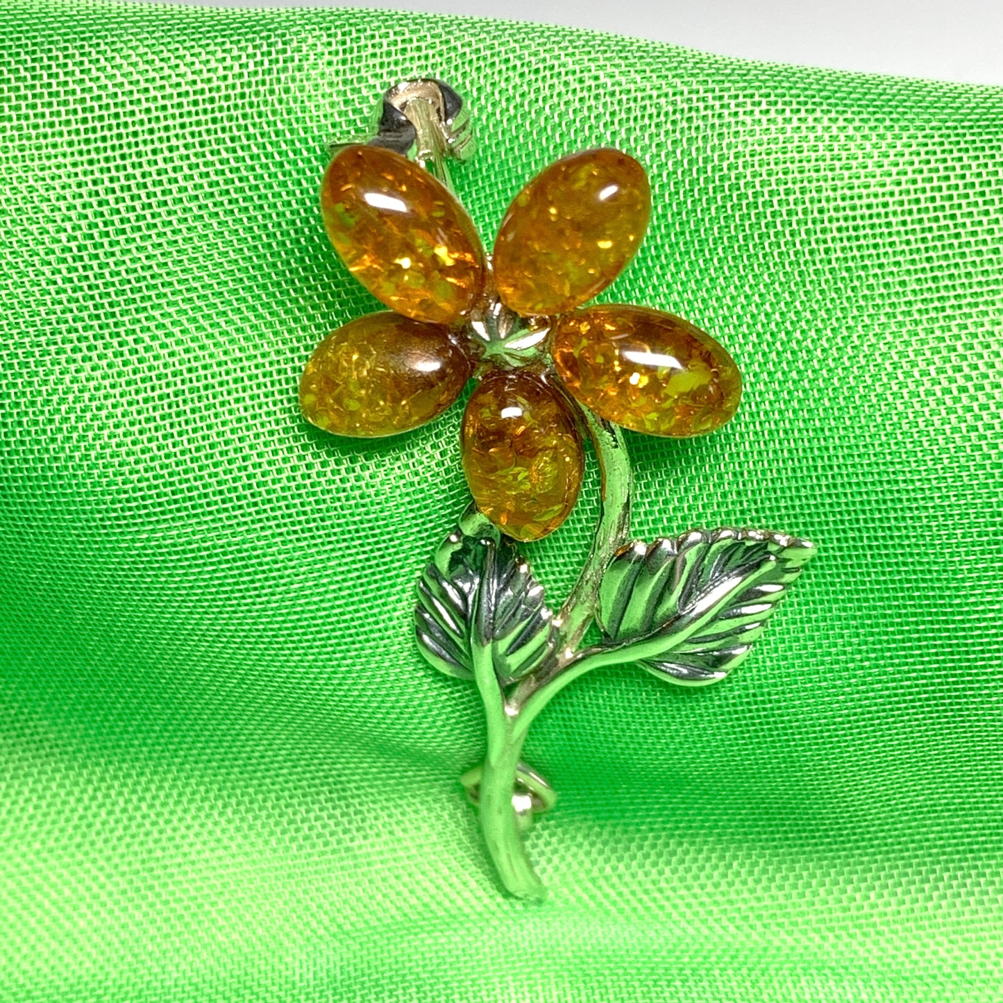 Sterling silver flower amber brooch