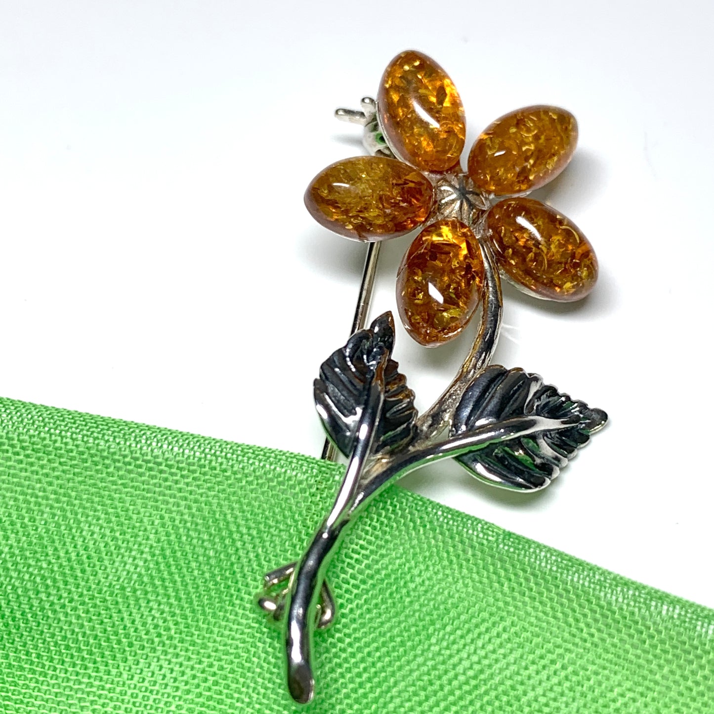 Sterling silver flower amber brooch