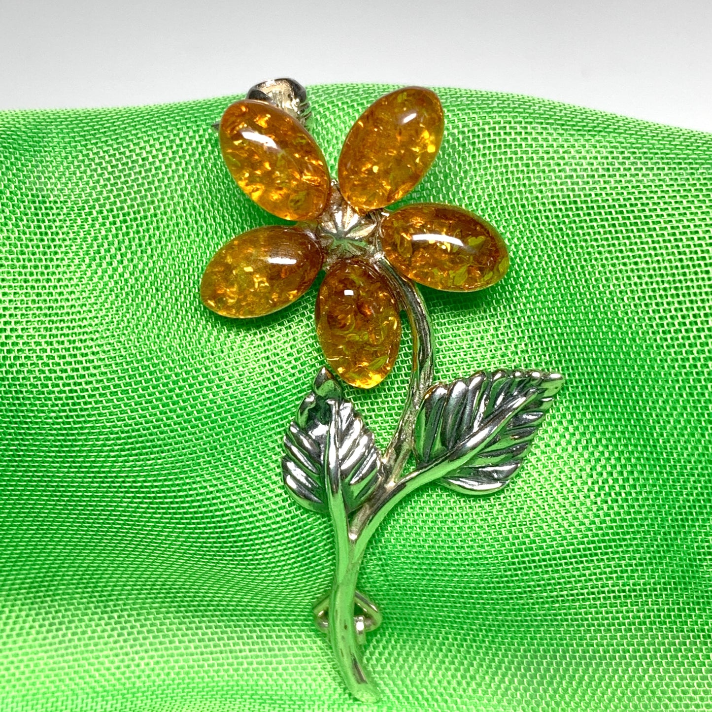 Sterling silver flower amber brooch