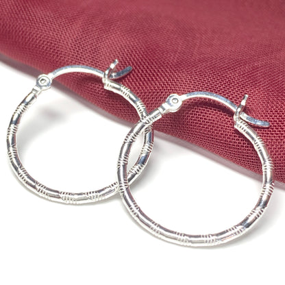 Sterling silver patterned hoop earrings