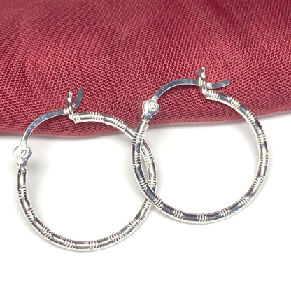 Sterling silver patterned hoop earrings