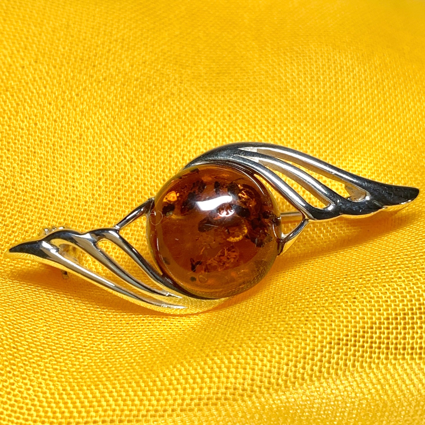 Sterling silver swirl fancy amber brooch