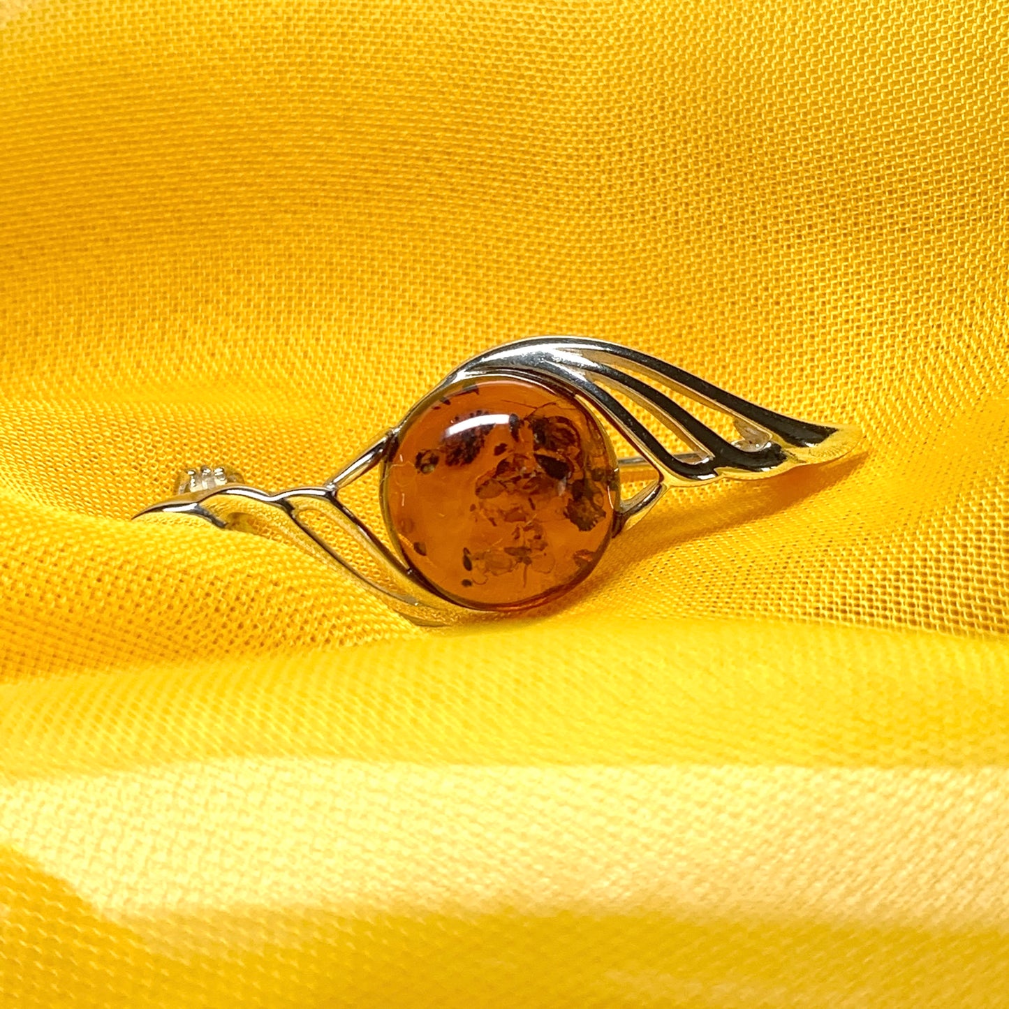 Sterling silver swirl fancy amber brooch