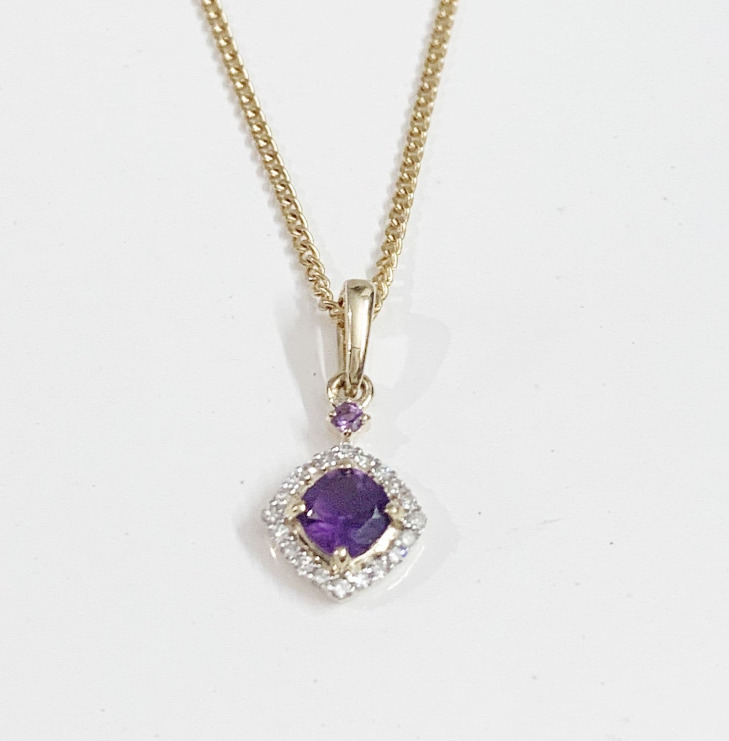 Amethyst and diamond yellow gold cushion cluster necklace