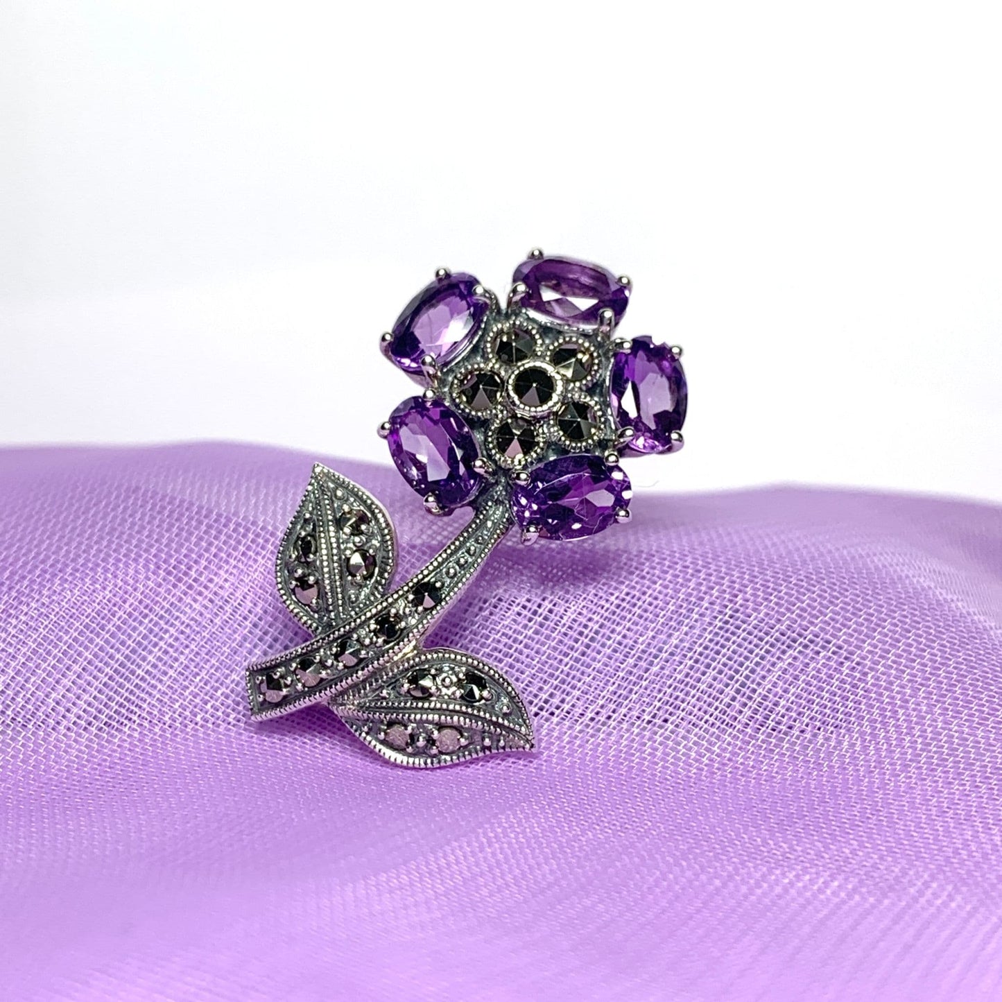 Amethyst and marcasite flower sterling silver brooch