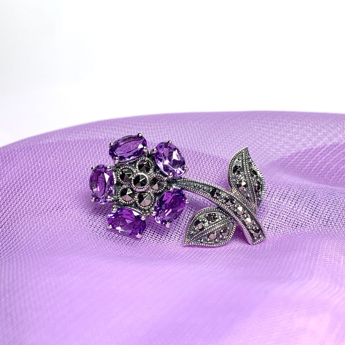Amethyst and marcasite flower sterling silver brooch