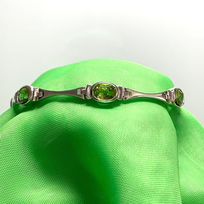 Silver peridot bracelet Oval stones