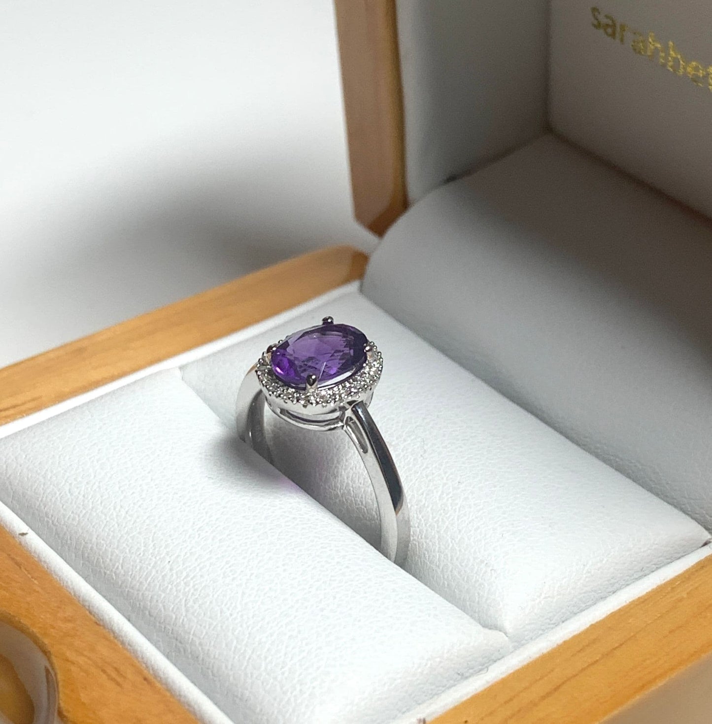 Oval cut amethyst and diamond white gold cluster ring