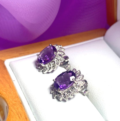 Oval shaped purple amethyst and diamond sterling silver cluster stud earrings