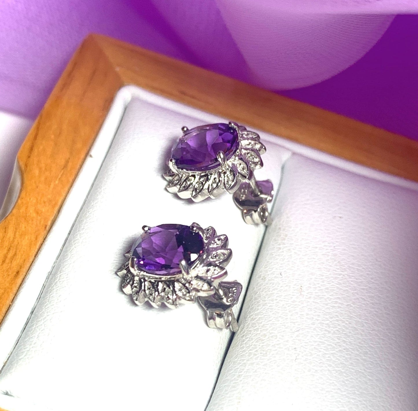 Oval shaped purple amethyst and diamond sterling silver cluster stud earrings