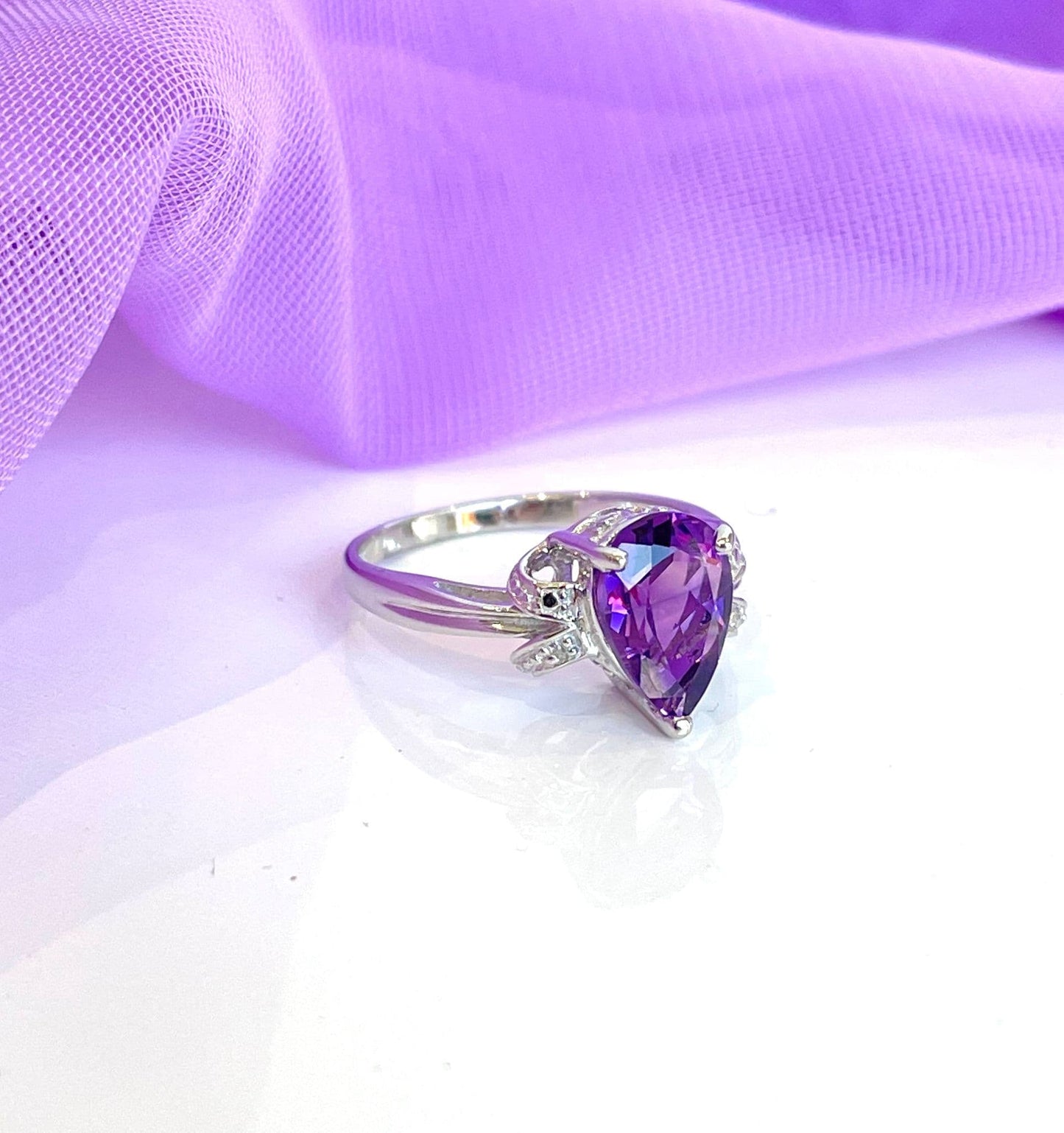 Pear shaped purple amethyst and diamond sterling silver dress ring