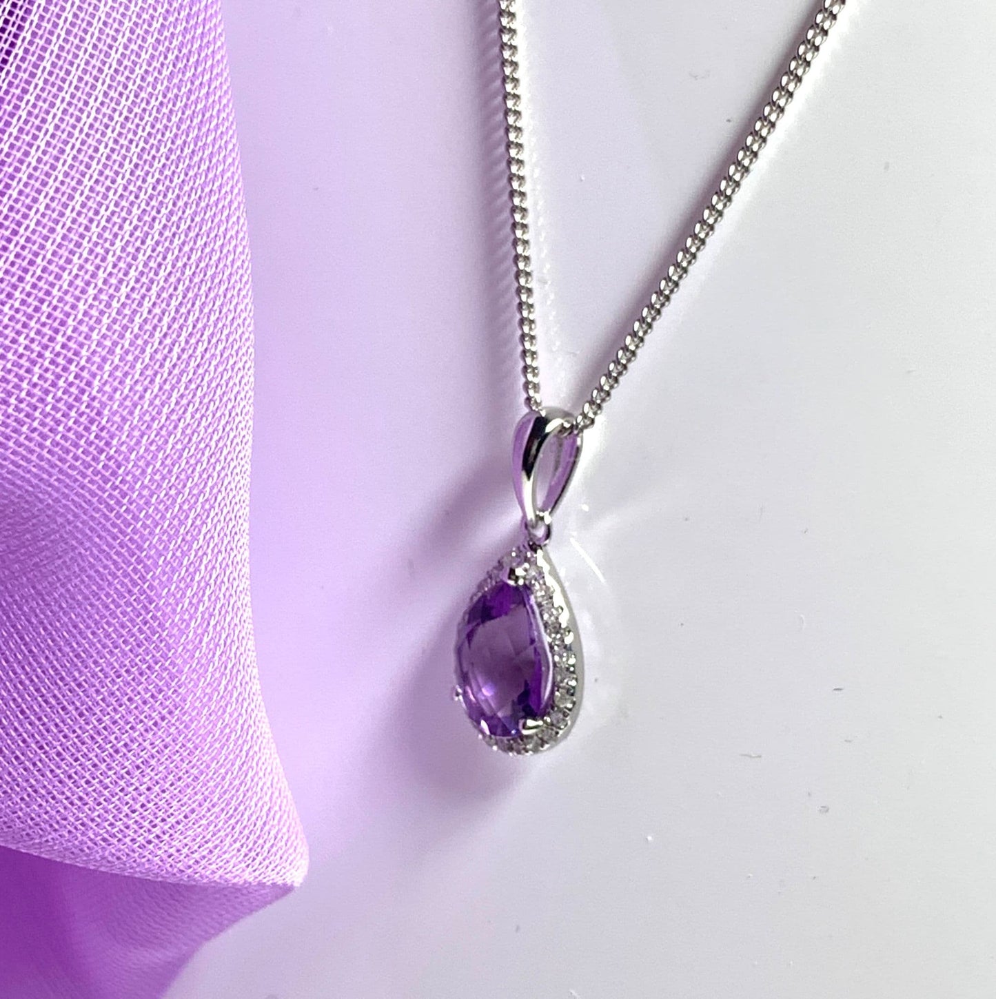 Pear shaped purple amethyst and diamond white gold necklace pendant