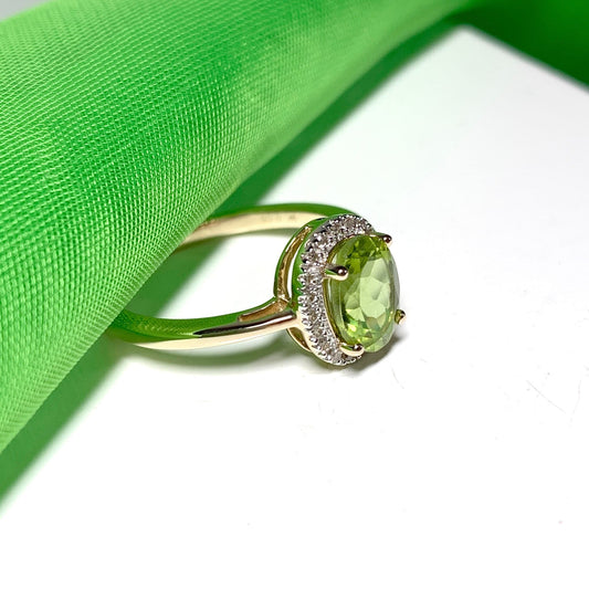 Peridot and diamond yellow gold oval cluster ring