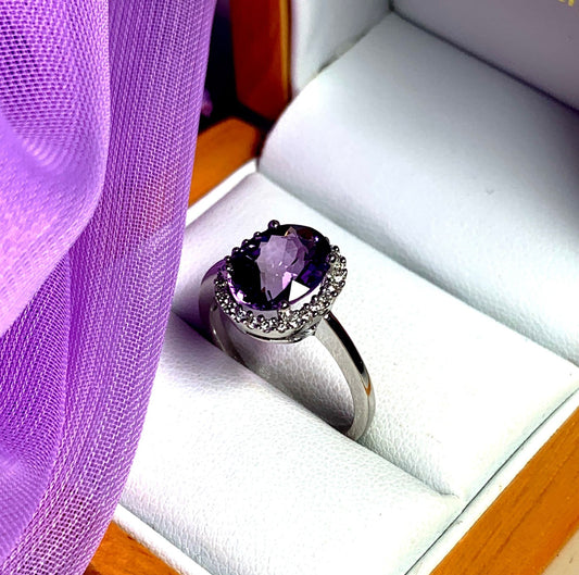 Purple oval amethyst and diamond white gold cluster ring