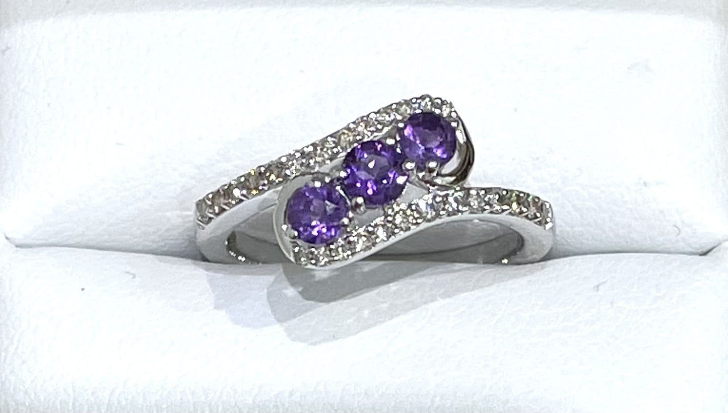 Purple twisted amethyst and diamond dress ring white gold