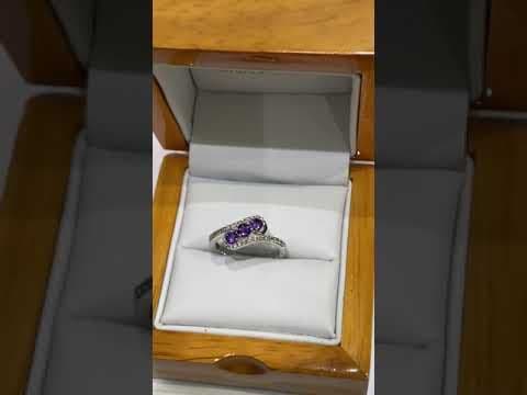 Purple twisted amethyst and diamond dress ring white gold
