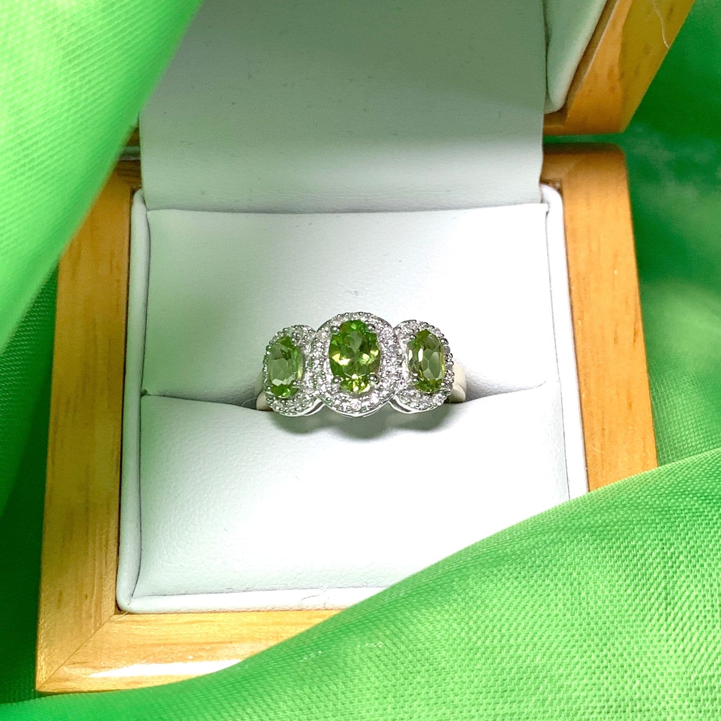 Trilogy Triple Oval Peridot and Diamond Yellow Gold Cluster Ring